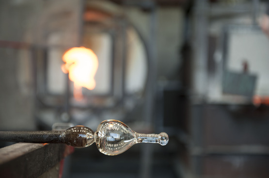 Image of a Glass bottle being made in the Hot Shop