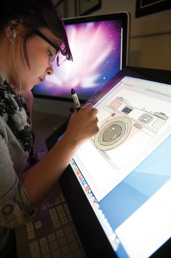 A student working on a project on a cintiq