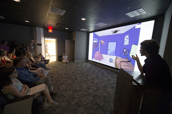 An Animation student shows their work during final critiques. 