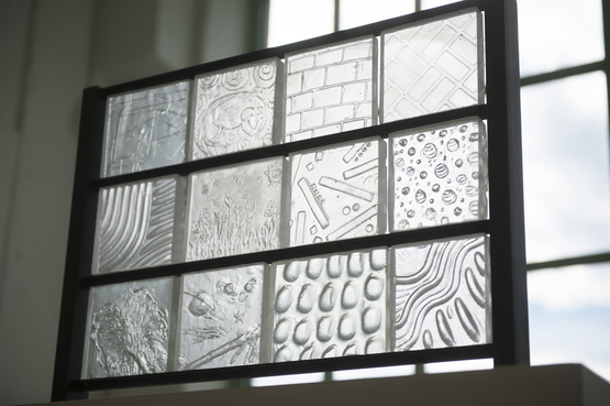 Clear textured glass arranged in a panel format. 