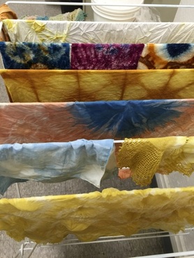 Dyed fabric hanging to dry during a one-day workshop. 