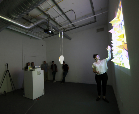 Students test an experimental projection and installation. 