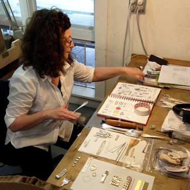 Argentieri working on jewelry in her studio