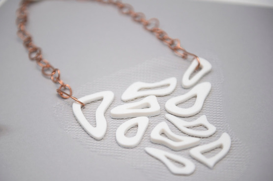 An orgically shaped 3D printed necklace made in the Wearable Art and Design class. 