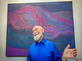 Julian Stanczak in front of his painting