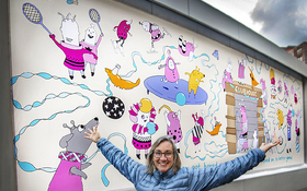 photo of Karen Sandstrom with mural