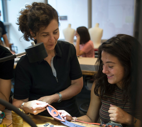 Pamela Argentieri reviews student's accessory design in the jewelry studio